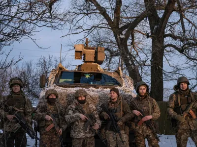 Ukrainian servicemen of the 80th Air Assault Brigade stand in front of a Bushmaster Protected Mobility Vehicle, amid Russia's attack on Ukraine, near Bahmut, Donetsk region, Ukraine, February 16, 2023. REUTERS/Marko Djurica