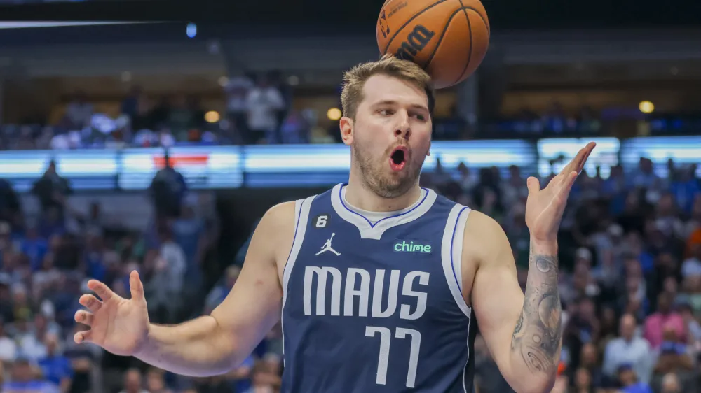 Dallas Mavericks guard Luka Doncic reacts after a foul call during the second half of an NBA basketball game against the Phoenix Suns, Sunday, March 5, 2023, in Dallas. (AP Photo/Gareth Patterson)