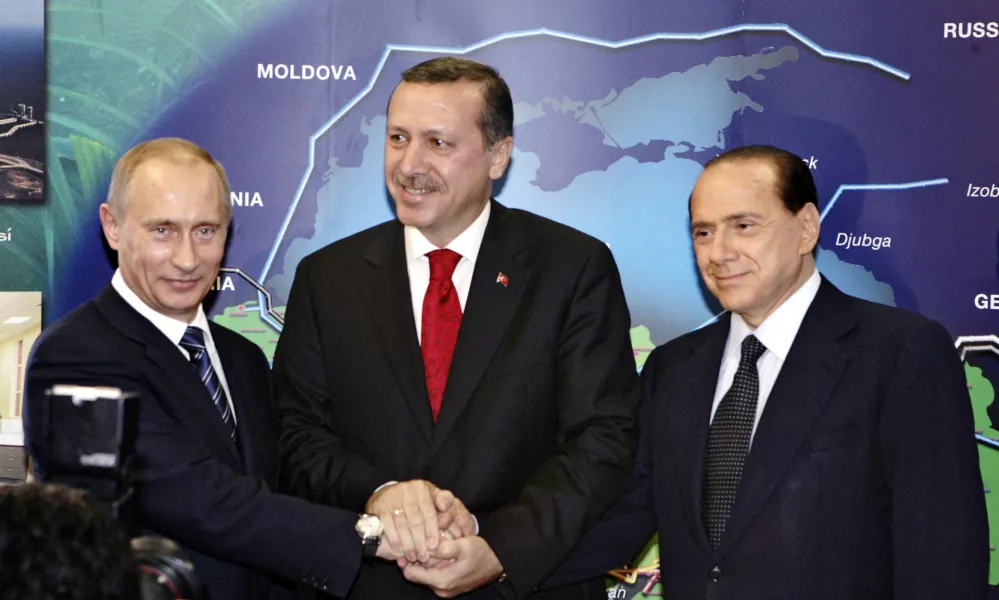 From left, Russian President Vladimir Putin, Turkish Prime Minister Recep Tayyip Erdogan and Italian Prime Minister Silvio Berlusconi pose for photographers at the pumping station in the village of Durusu, near the northern Turkish city of Samsun, Thursday, Nov. 17, 2005, during the inauguration ceremony of the Blue Stream pipeline, the world's deepest undersea pipeline. Russian President Vladimir Putin and Turkey's prime minister officially opened a US$3.2 billion (2.6 billion) pipeline connecting Turkey to Russian gas fields and spoke of Turkey's potential to become an energy hub for Europe and Israel.(AP Photo/ITAR-TASS/Presidential Press Service, Sergey Zhukov)