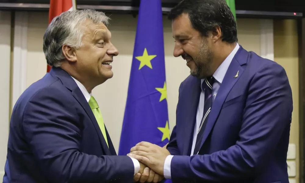 ﻿Italy's Interior Minister and Deputy-Premier Matteo Salvini, right, shakes hand with Hungary's Prime Minister Viktor Orban after their meeting in Milan, Italy, Tuesday, Aug. 28, 2018. (AP Photo/Luca Bruno)