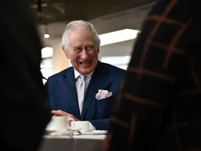 Britain's King Charles III meets with volunteers and service users of the charity organisation Age UK, during an afternoon tea at the Colchester Library during a visit in Colchester, Britain on March 7, 2023.   BEN STANSALL/Pool via REUTERS