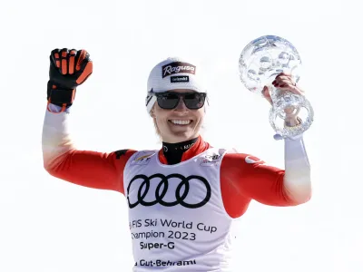 Alpine Skiing - FIS Alpine Ski World Cup - Women's Super G - Soldeu, Andorra - March 16, 2023 Switzerland's Lara Gut-Behrami celebrates with the crystal globe after winning the women's Super G for the season REUTERS/Albert Gea