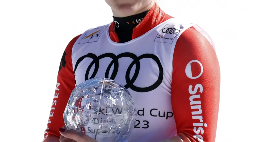 Alpine Skiing - FIS Alpine Ski World Cup - Women's Super G - Soldeu, Andorra - March 16, 2023 Switzerland's Lara Gut-Behrami celebrates with the crystal globe after winning the women's Super G for the season REUTERS/Albert Gea