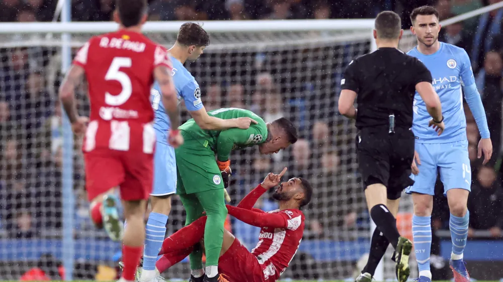 Soccer Football - Champions League - Quarter-Final - First Leg - Manchester City v Atletico Madrid - Etihad Stadium, Manchester, Britain - April 5, 2022 Atletico Madrid's Matheus Cunha clashes with Manchester City's Ederson REUTERS/Phil Noble