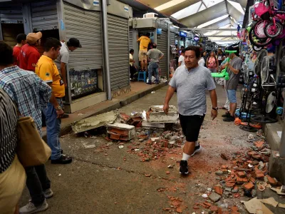 A man passes by debris following an earthquake in Guayaquil, Ecuador March 18, 2023. REUTERS/Vicente Gaibor Del Pino