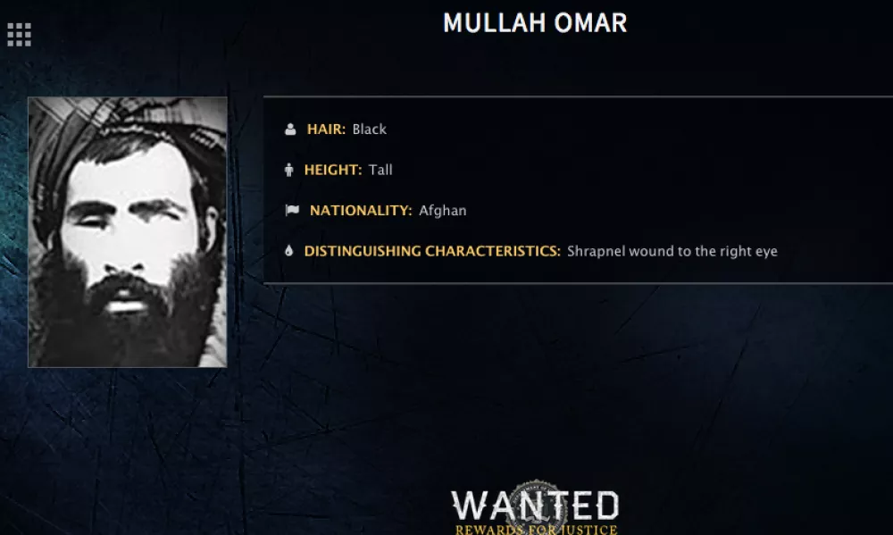 FILE - In this undated image released by the FBI, Mullah Omar is seen in a wanted poster. An Afghan official says his government is examining claims that reclusive Taliban leader Mullah Omar is dead. The Taliban could not be immediately reached for comment on the government?s comments about Omar, who has been declared dead many times before. (FBI via AP, File)