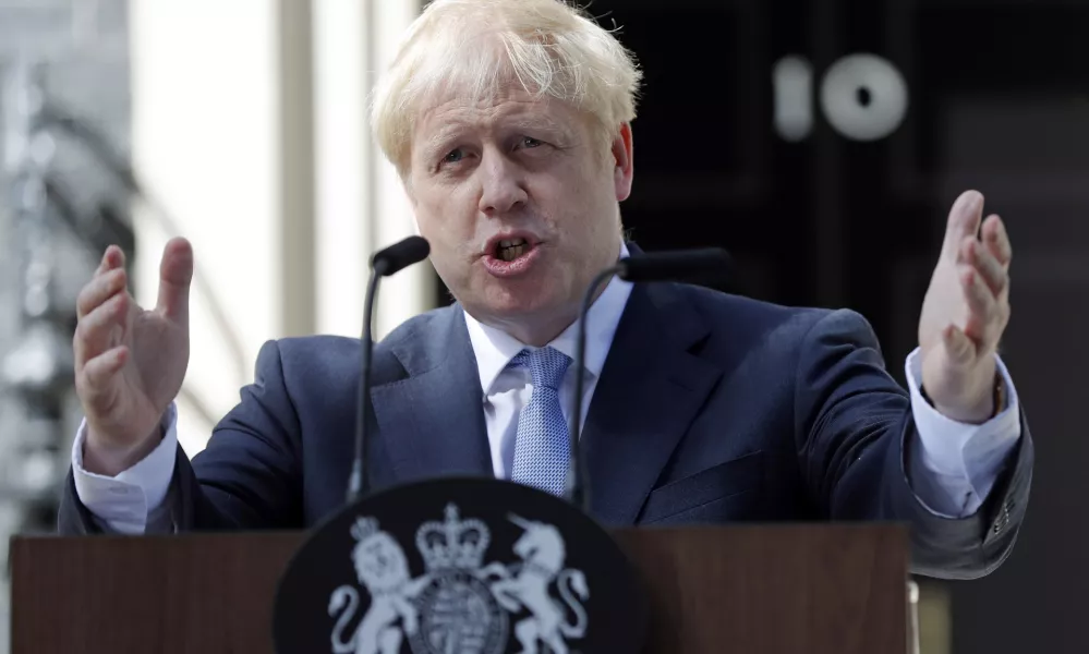 ﻿FILE - In this file photo dated Wednesday, July 24, 2019, Britain's newly installed Prime Minister Boris Johnson gestures as he speaks outside 10 Downing Street in London. The Brexit decision to split from the European Union was fuelled by a sense that the U.K. is fundamentally separate from its continental neighbours, and leading Brexit campaigner Boris Johnson once compared the EU to the conquests of Napoleon and Hitler. (AP Photo/Frank Augstein, FILE)