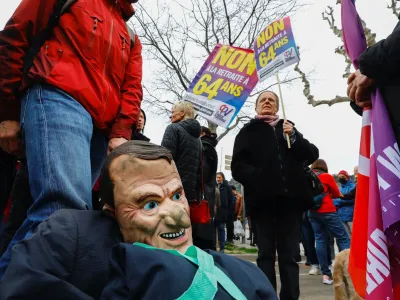 A puppet figure depicting French President Emmanuel Macron is seen as protesters attend a demonstration to protest the use of the article 49.3, a special clause in the French Constitution, to push the pensions reform bill through the National Assembly without a vote by lawmakers, by French government, in Nice, France, March 19, 2023. REUTERS/Eric Gaillard