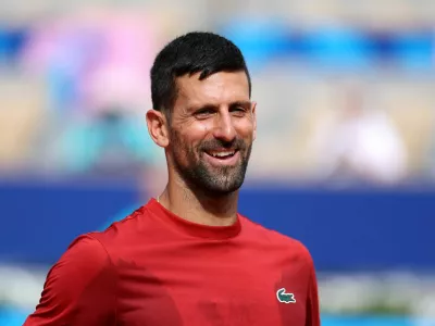 Paris 2024 Olympics - Tennis Training - Roland-Garros Stadium, Paris, France - July 25, 2024. Novak Djokovic of Serbia reacts during training. REUTERS/Claudia Greco