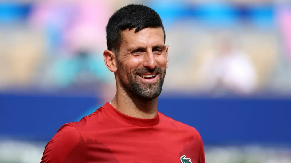 Paris 2024 Olympics - Tennis Training - Roland-Garros Stadium, Paris, France - July 25, 2024. Novak Djokovic of Serbia reacts during training. REUTERS/Claudia Greco