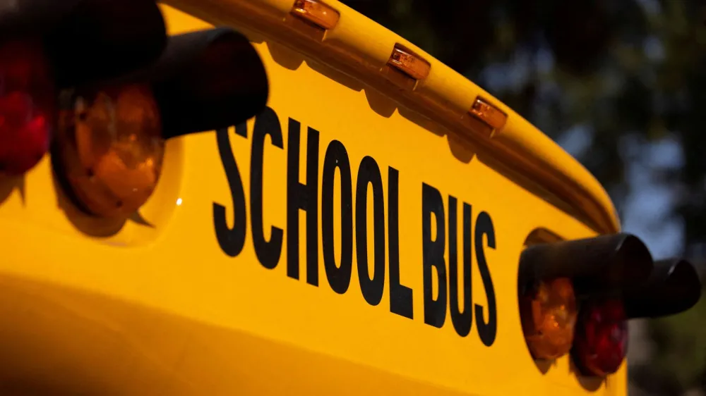 FILE PHOTO: School buses line up in Los Angeles, California, U.S., August 30, 2021. REUTERS/Mike Blake/File Photo/File Photo