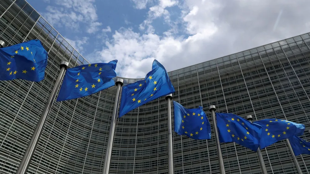 FILE PHOTO: European Union flags flutter outside the European Commission headquarters in Brussels, Belgium, June 5, 2020. REUTERS/Yves Herman/File Photo