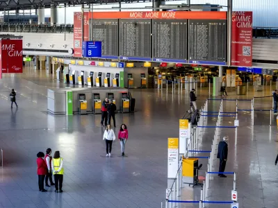 An almost deserted terminal at the airport in Frankfurt, Germany, Monday, March 27, 2023. Trains, planes and public transit systems stood still across much of Germany on Monday as labor unions called a major one-day strike over salaries in an effort to win inflation-busting raises for their members. (AP Photo/Michael Probst)