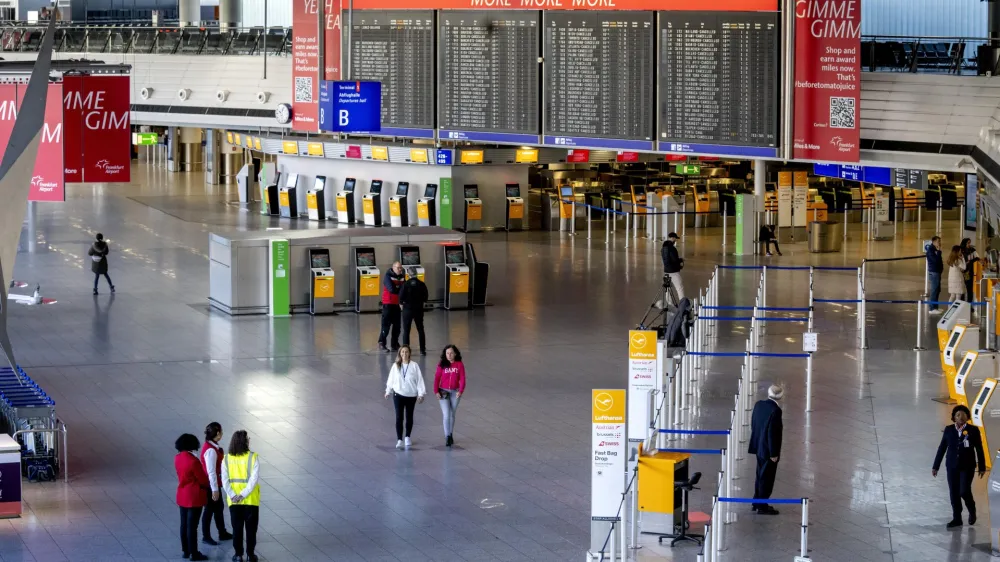 An almost deserted terminal at the airport in Frankfurt, Germany, Monday, March 27, 2023. Trains, planes and public transit systems stood still across much of Germany on Monday as labor unions called a major one-day strike over salaries in an effort to win inflation-busting raises for their members. (AP Photo/Michael Probst)