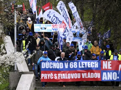 Protesters march during a demonstration of the KOVO trade union against the changes in the pension system considered by the government, in Prague, Czech Republic, Wednesday March 29, 2023. (Michal Kamaryt/CTK via AP)