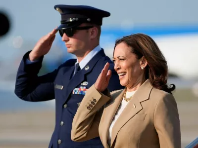 U.S. Vice President Kamala Harris salutes upon arrival at Joint Base Andrews in Maryland, July 27, 2024. Stephanie Scarbrough/Pool via REUTERS