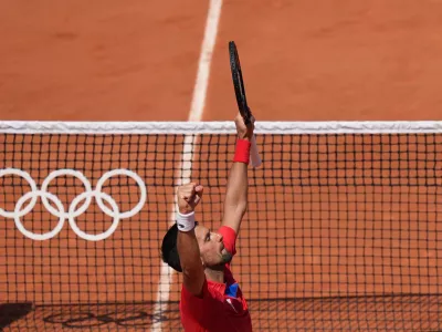 29 July 2024, France, Paris: Serbian tennis player Novak Djokovic celebrates after defeating Spain's Rafael Nadal in their men's singles second tennis match of the Paris 2024 Olympic Games. Photo: Marcus Brandt/dpa