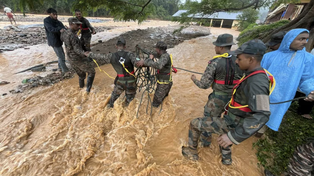 This photograph provided by PRO Defense Kochi shows Indian army soldiers engaged in rescue operations at landslide affected village in Wayanad in southern Kerala, India, Tuesday, July 30, 2024. (PRO Defense Kochi via AP)