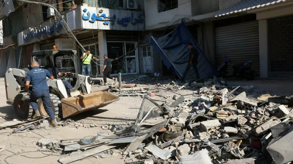 Municipal police members remove the rubble at a damaged site the day after an Israeli strike, in Beirut's southern suburbs, Lebanon July 31, 2024. REUTERS/Mohamed Azakir