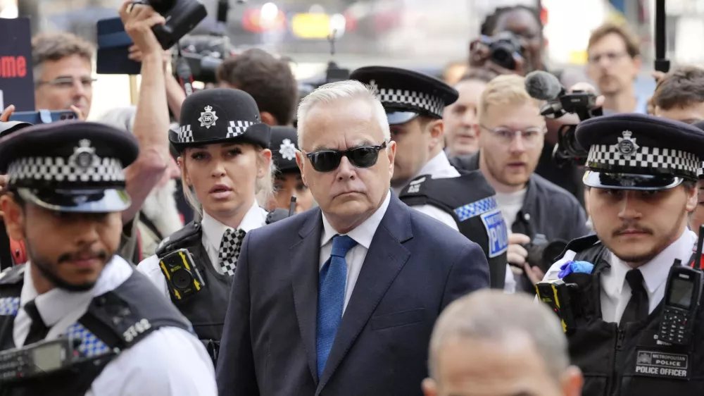 Former BBC broadcaster Huw Edwards arrives at Westminster Magistrates' Court in London, Wednesday July 31, 2024 where he is charged with three counts of making indecent images of children following a Metropolitan Police investigation. (Jonathan Brady/PA via AP)