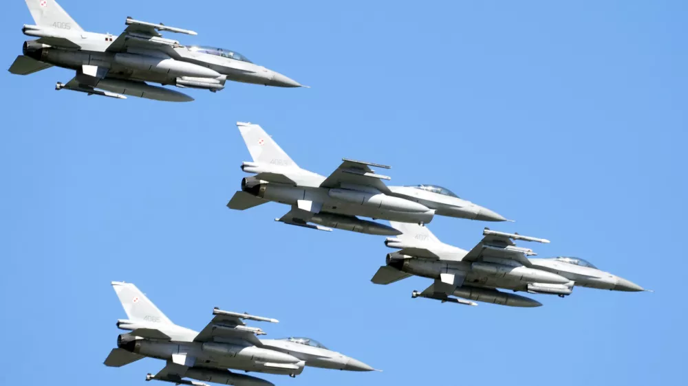 FILE - U.S. made F-16 fighter jets fly in the sky over Poland's capital as they take part in a massive military parade to celebrate the Polish Army Day, in Warsaw, Poland, Aug. 15, 2023. Ukraine has received the first tranche of western F-16 fighter jets that it has sought for months to be able to fight back against an onslaught of Russian missile strikes, a U.S. official confirmed to the Associated Press. Ukraine has been pushing to get Western F-16s for Ukraine for months, saying they were critically needed to fight back against the onslaught of missiles Russia has fired against them. (AP Photo/Czarek Sokolowski, File)