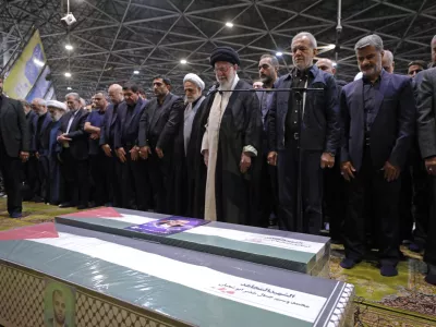 HANDOUT - 01 August 2024, Iran, Tehran: Iranian Supreme Leader Ayatollah Ali Khamenei (C) and Iranian President Masoud Pezeshkian with other officials perform the funeral prayer for Hamas leader Ismail Haniyeh and his bodyguard. Photo: Iranian Supreme Leader's Office/ZUMA Press Wire/dpa - ATTENTION: editorial use only and only if the credit mentioned above is referenced in full