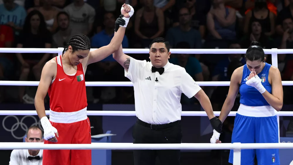 01 August 2024, France, Paris: Algeria's Imane Khelif (Red) celebrates after Italy's Angela Carini abandoned the bout during the Women's 66kg round of 16 at North Paris Arena as part of the 2024 Paris Summer Olympic Games. Photo: Joel Carrett/AAP/dpa