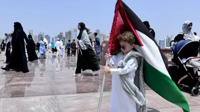 DOHA, QATAR - AUGUST 2: A child holds a Palestinian flag as people attend funeral ceremony, held for Hamas political chief Ismail Haniyeh, who was assassinated in Tehran, at Imam Abdul Wahhab Mosque in Doha, Qatar on August 2, 2024. Ali Altunkaya / AnadoluNo Use USA No use UK No use Canada No use France No use Japan No use Italy No use Australia No use Spain No use Belgium No use Korea No use South Africa No use Hong Kong No use New Zealand No use Turkey