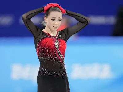 ﻿Kamila Valieva, 15, of the Russian Olympic Committee, reacts after the women's team free skate program during the figure skating competition at the 2022 Winter Olympics, Monday, Feb. 7, 2022, in Beijing. The 2022 Games' first major scandal has managed to involve the 15-year-old figure skater who has tested positive for using a banned heart medication that may cost her Russia-but-not-really-Russia team a gold medal in team competition. Kamila Valieva continues to train even as her final disposition is considered, and she may yet compete in the women's individual competition, in which she is favored. (AP Photo/Natacha Pisarenko)