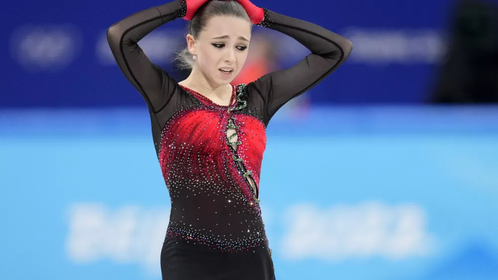 ﻿Kamila Valieva, 15, of the Russian Olympic Committee, reacts after the women's team free skate program during the figure skating competition at the 2022 Winter Olympics, Monday, Feb. 7, 2022, in Beijing. The 2022 Games' first major scandal has managed to involve the 15-year-old figure skater who has tested positive for using a banned heart medication that may cost her Russia-but-not-really-Russia team a gold medal in team competition. Kamila Valieva continues to train even as her final disposition is considered, and she may yet compete in the women's individual competition, in which she is favored. (AP Photo/Natacha Pisarenko)