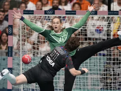 Goalkeeper Evelina Eriksson, of Sweden, tries to block the shot of Ryu Eun Hee, of South Korea, during a women's handball match at the 2024 Summer Olympics, Thursday, Aug. 1, 2024, in Paris, France. (AP Photo/Aaron Favila)