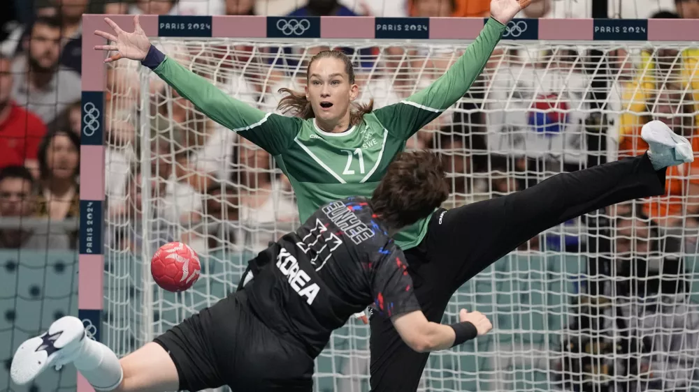 Goalkeeper Evelina Eriksson, of Sweden, tries to block the shot of Ryu Eun Hee, of South Korea, during a women's handball match at the 2024 Summer Olympics, Thursday, Aug. 1, 2024, in Paris, France. (AP Photo/Aaron Favila)