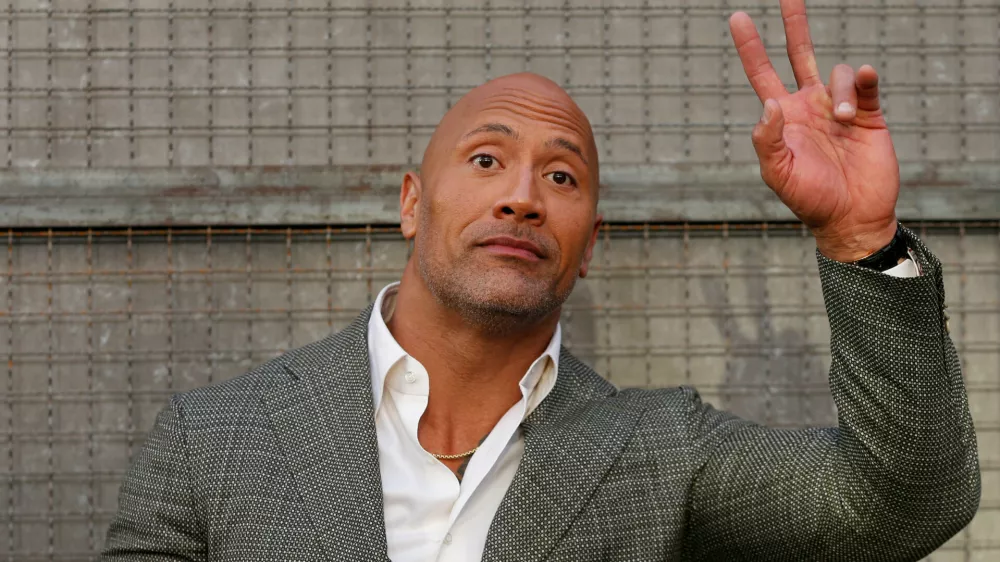 Cast member Dwayne Johnson poses at the premiere for the movie "Rampage" in Los Angeles, California, U.S., April 4, 2018. REUTERS/Mario Anzuoni