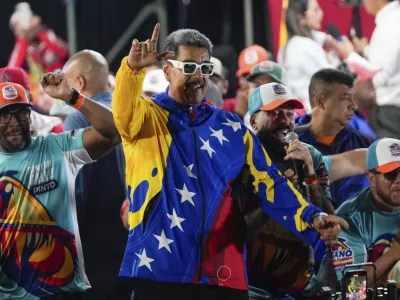 President Nicolas Maduro dances outside the Miraflores presidential palace after electoral authorities declared him the winner of the presidential election in Caracas, Venezuela, Monday, July 29, 2024. (AP Photo/Fernando Vergara)