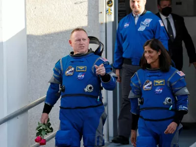 FILE PHOTO: NASA astronauts Butch Wilmore and Suni Williams walk at NASA's Kennedy Space Center, ahead of Boeing's Starliner-1 Crew Flight Test (CFT) mission on a United Launch Alliance Atlas V rocket to the International Space Station, in Cape Canaveral, Florida, U.S. May 6, 2024. REUTERS/Joe Skipper/File Photo