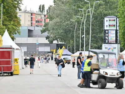 People and security walk outside Happel stadium after Taylor Swift's three concerts this week were canceled after the government confirmed a planned attack at the stadium in Vienna, Austria, August 8, 2024. REUTERS/Elisabeth Mandl