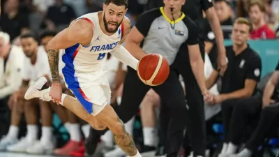 Isaia Cordinier (8), of France drives to the basket against Germany during a men's semifinals basketball game at Bercy Arena at the 2024 Summer Olympics, Thursday, Aug. 8, 2024, in Paris, France. (AP Photo/Mark J. Terrill)