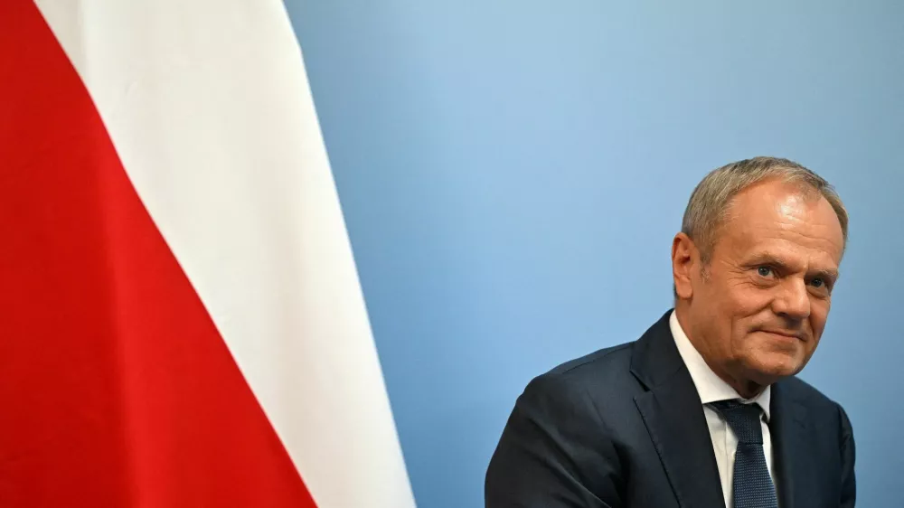 FILE PHOTO: Poland's Prime Minister Donald Tusk reacts during a UK Bilateral meeting with Britain's Prime Minister Keir Starmer, at the European Political Community meeting, at Blenheim Palace in Woodstock, Britain, on July 18, 2024.   JUSTIN TALLIS/Pool via REUTERS/File Photo