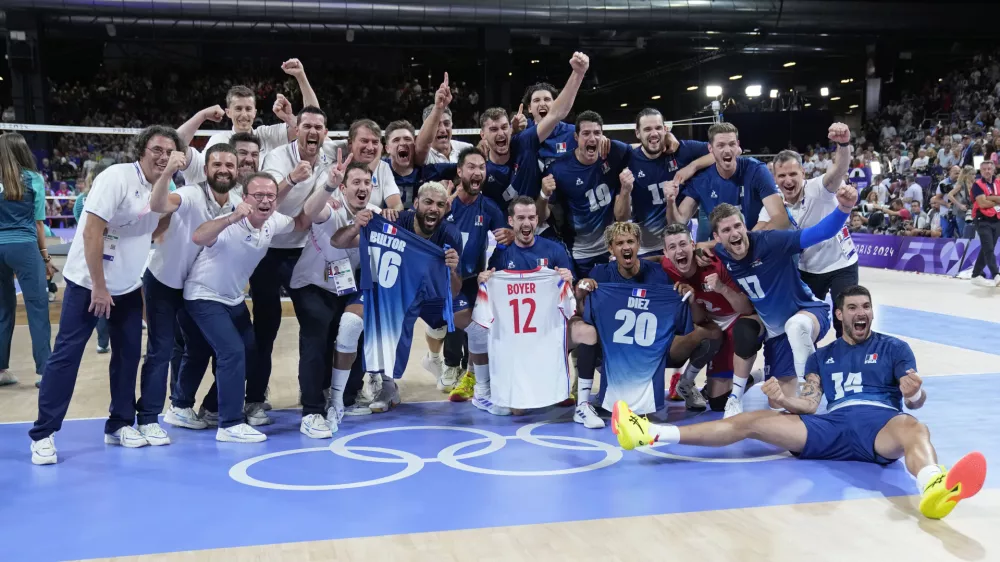 The French team pose for a photo after winning a gold medal men's volleyball match against Poland at the 2024 Summer Olympics, Saturday, Aug. 10, 2024, in Paris, France. (AP Photo/Dolores Ochoa)