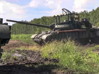 In this photo taken from video released by the Russian Defense Ministry on Saturday, Aug. 10, 2024, Russian Army tanks take a position at an area of ​​Kursk region of Russia. (Russian Defense Ministry Press Service via AP)