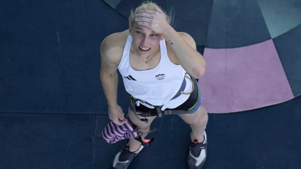 Janja Garnbret of Slovenia reacts after winning the gold during the women's boulder and lead final for the sport climbing competition at the 2024 Summer Olympics, Saturday, Aug. 10, 2024, in Le Bourget, France. (AP Photo/Christophe Ena, Pool)