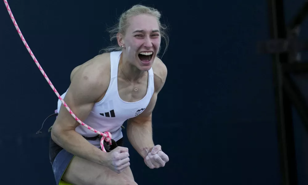 Janja Garnbret of Slovenia reacts after winning the gold during the women's boulder and lead final for the sport climbing competition at the 2024 Summer Olympics, Saturday, Aug. 10, 2024, in Le Bourget, France. (AP Photo/Tsvangirayi Mukwazhi)