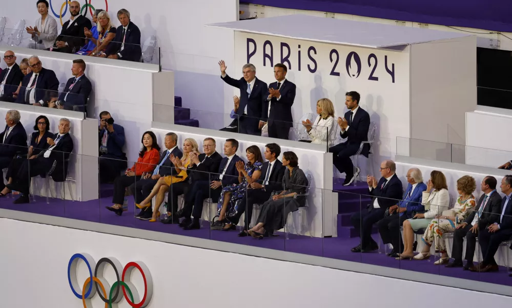 Paris 2024 Olympics - Ceremonies - Paris 2024 Closing Ceremony - Stade de France, Saint-Denis, France - August 11, 2024. International Olympic Committee (IOC) President Thomas Bach, President of France Emmanuel Macron, his wife, Brigitte Macron, and Paris 2024 President Tony Estanguet are pictured during the closing ceremony. REUTERS/Anushree Fadnavis