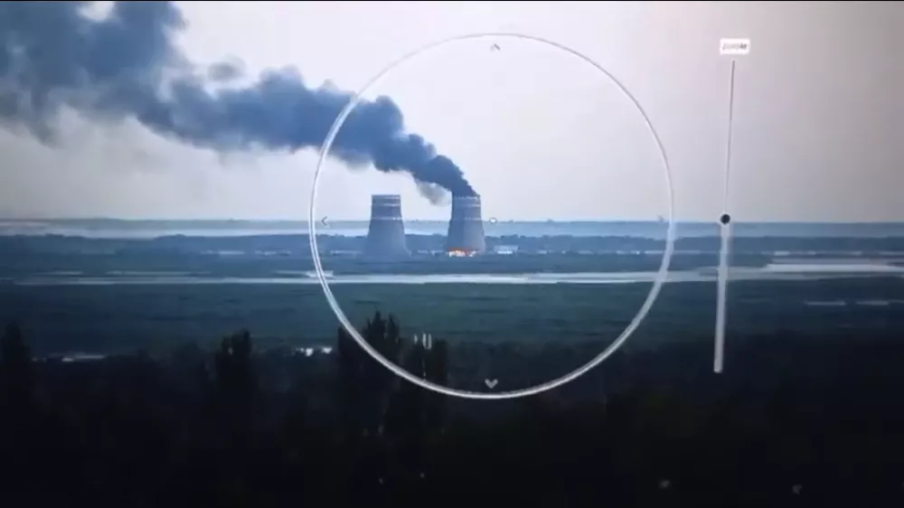 In this image from a surveillance camera provided by the Ukrainian Presidential Press Office, smoke rises from a cooling tower of the Zaporizhzhia Nuclear Power Station in a Russia-controlled area in the Energodar, Zaporizhzhia region of Ukraine, Sunday, Aug. 11, 2024. (Ukrainian Presidential Press Office via AP)