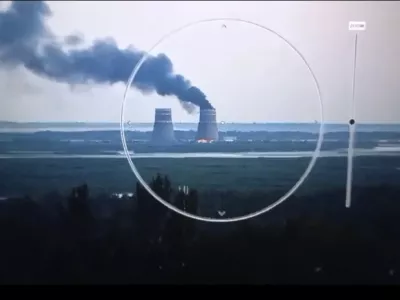 In this image from a surveillance camera provided by the Ukrainian Presidential Press Office, smoke rises from a cooling tower of the Zaporizhzhia Nuclear Power Station in a Russia-controlled area in the Energodar, Zaporizhzhia region of Ukraine, Sunday, Aug. 11, 2024. (Ukrainian Presidential Press Office via AP)