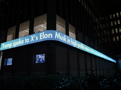 The Fox News ticker shows the news of Elon Musk's interview with Republican presidential candidate and former U.S. President Donald Trump on the X social media network, in New York City, U.S. August 12, 2024. REUTERS/Adam Gray