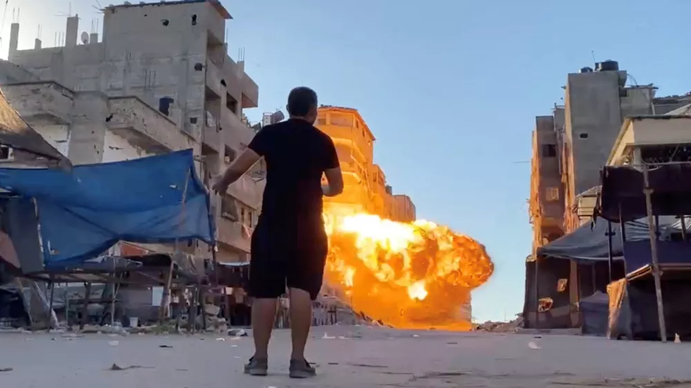 Flames rise following an Israeli strike on a residential building, amid the ongoing conflict between Israel and Hamas, in Gaza City, in this screen grab taken from a video, August 11, 2024. Reuters TV via REUTERS