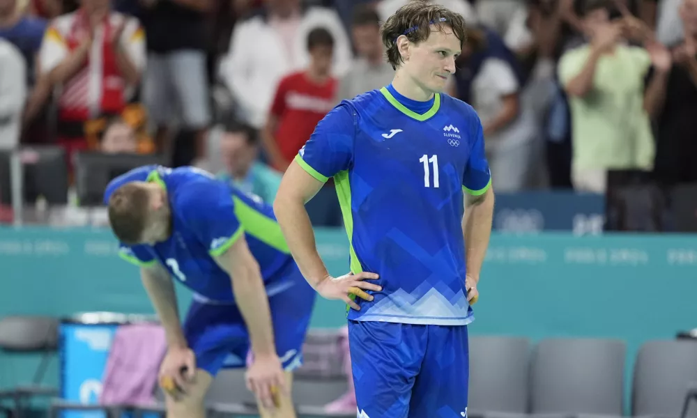 Slovenia's Jure Dolenec is after during a semifinal handball match between Slovenia and Denmark at the 2024 Summer Olympics, Friday, Aug. 9, 2024, in Villeneuve-d'Ascq, France. (AP Photo/Aaron Favila)