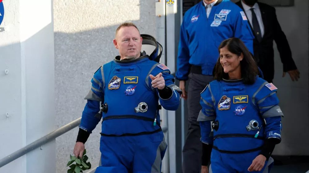 FILE PHOTO: NASA astronauts Butch Wilmore and Suni Williams walk at NASA's Kennedy Space Center, ahead of Boeing's Starliner-1 Crew Flight Test (CFT) mission on a United Launch Alliance Atlas V rocket to the International Space Station, in Cape Canaveral, Florida, U.S. May 6, 2024. REUTERS/Joe Skipper/File Photo