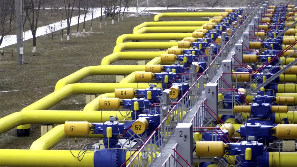 FILE - A set of pipes in a gas storage and transit point in Boyarka, just outside Kiev, Ukraine, Jan. 3, 2006. (AP Photo/Sergei Chuzavkov, File)